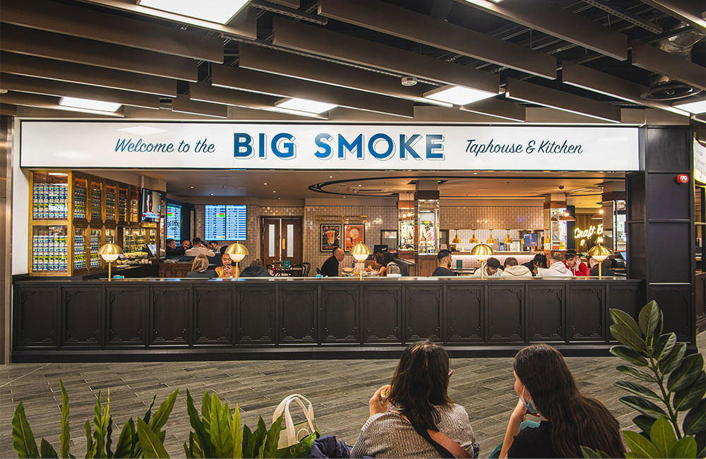Guests outside Big Smoke Taphouse & Kitchen in the terminal